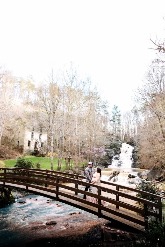 Waterfall wedding venue with romantic bridge over a river