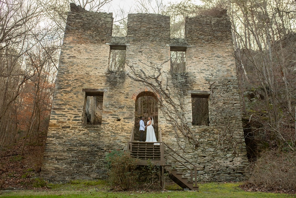 Bride and groom exchange vows at a garden wedding venue, waterfall wedding venue, historic wedding venue near Atlanta
